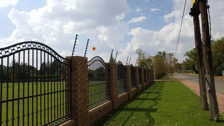 Electric fence on brick pillars and railings