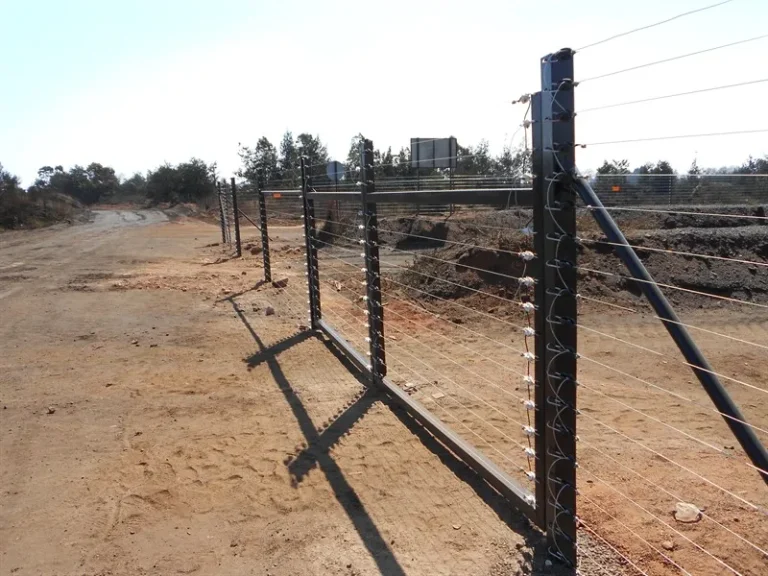 Freestanding electric fence along an industrial yard