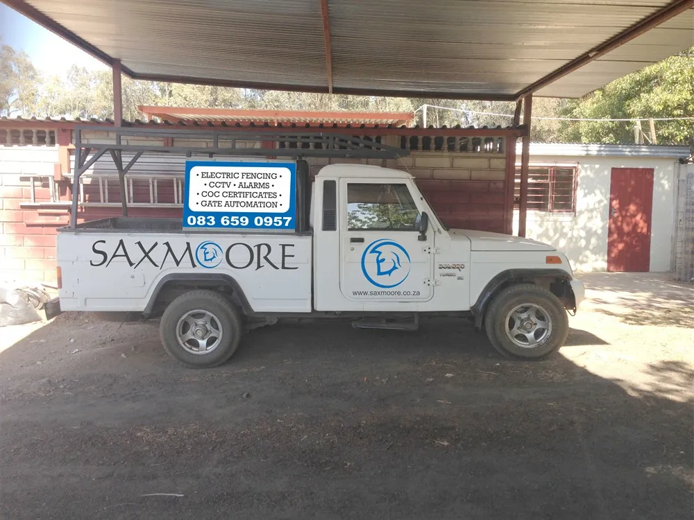 Saxmoore Mahindra bakkie with the company's services and phone number on the side